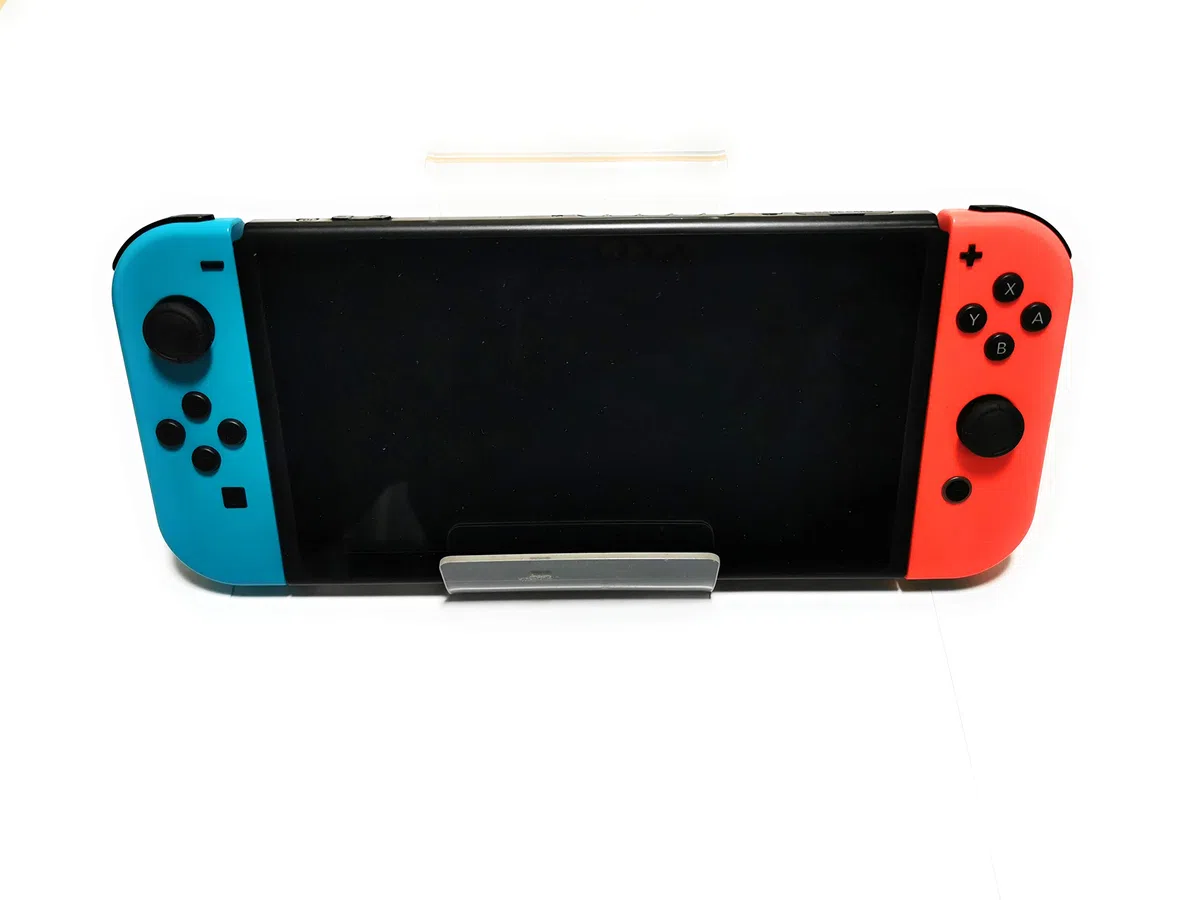 Nintendo Switch (Neon Red/Neon Blue) + £30 Nintendo eShop Voucher [Importación inglesa]